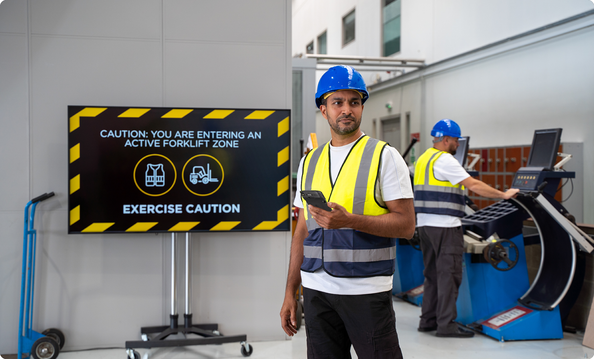 Frontline workers using mobile technology in a warehouse