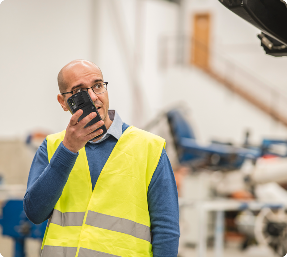 Worker using a Zebra device in a warehouse