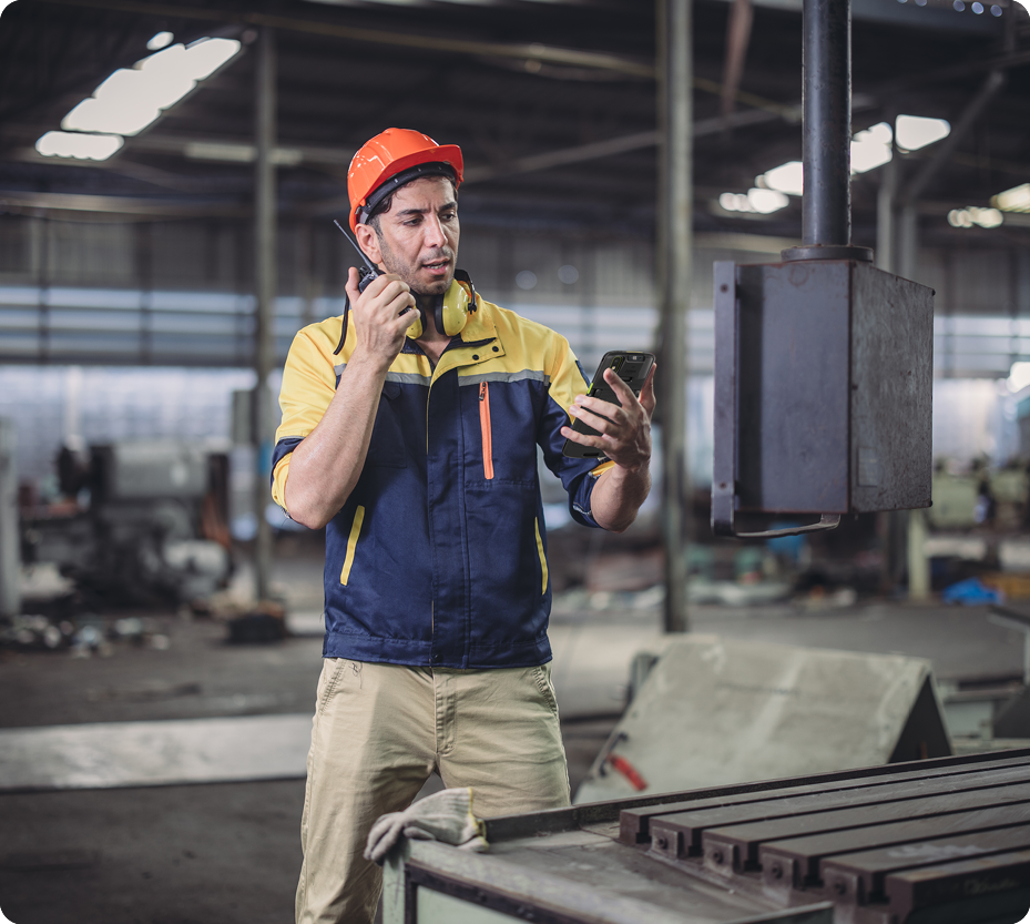 Industrial worker using rugged mobile devices
